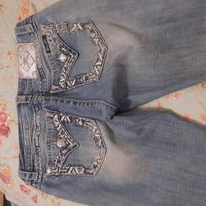 Miss Me signature straight light denim jeans.